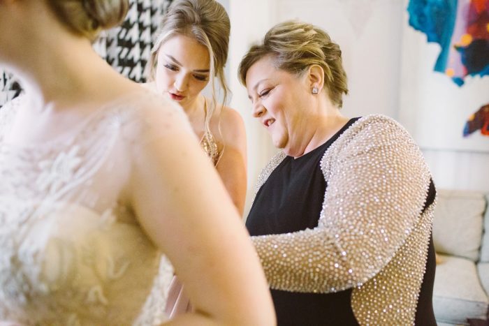 Bride Getting Dressed: Small Eclectic Wedding at Smallman Galley from Caitlin Thomas Photography featured on Burgh Brides
